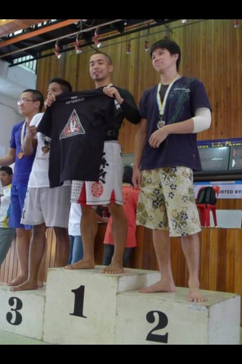 Students on the podium with their medals after an event